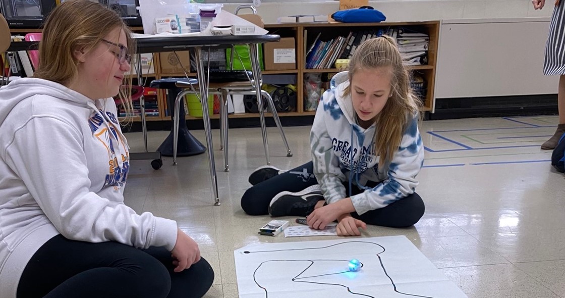 Two students working with Ozobots